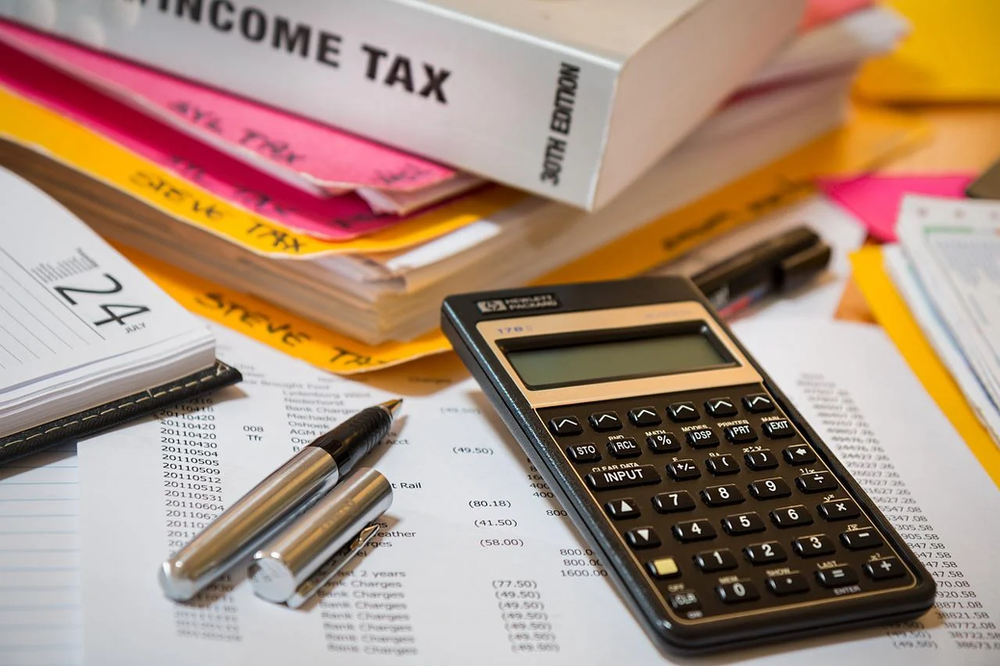 income tax book with scientific calculator 1